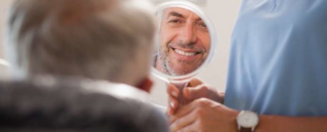 A man is looking at himself in the mirror